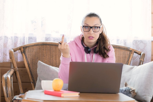 portrait woman using phone while sitting table 1048944 13399894