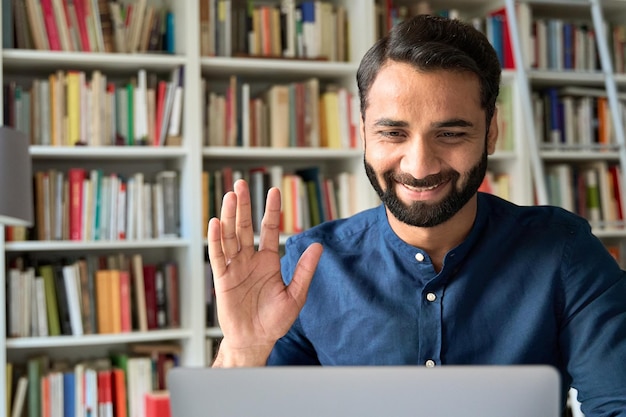smiling indian business man teacher online working by video call hybrid meeting 562687 3287